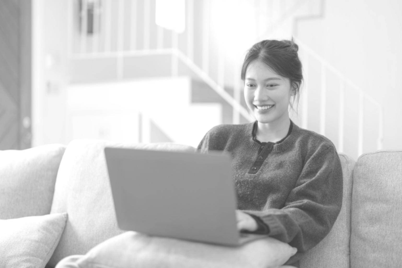 Person writing in financial planning journal with calculator nearby